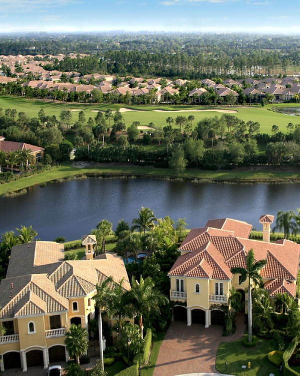 Two luxurious homes with contrasting roof colors